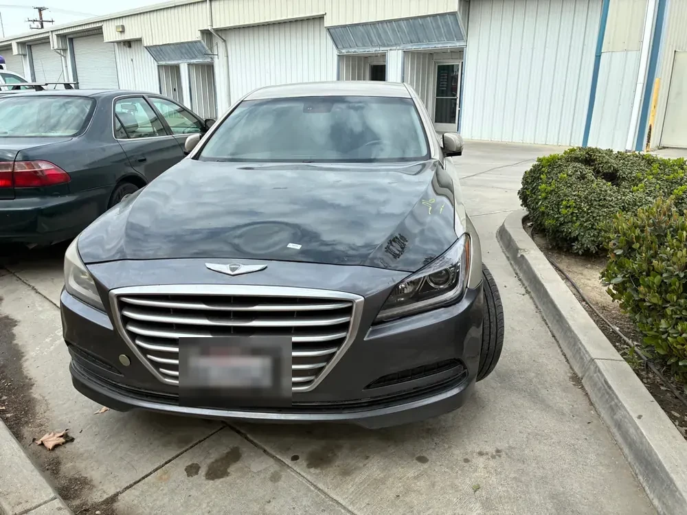 A Hyundai Genesis in a lot in Lake Havasu, waiting on a mobile mechanic